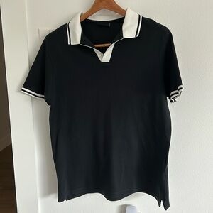 Emporio Armani short sleeve polo shirt.  Only worn once.  It is a M runs SM.